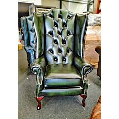 antique green high back Chesterfield wing chair