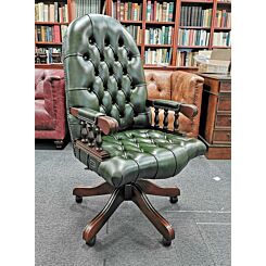 Mahogany English swivel chair in Classic green leather