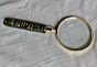 Magnifying glass with green handle