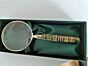 Magnifying glass with green handle